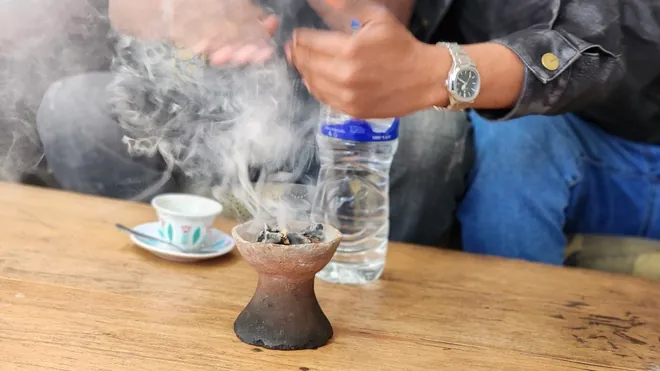 Traditional Ethiopian coffee ceremony with incense smoke