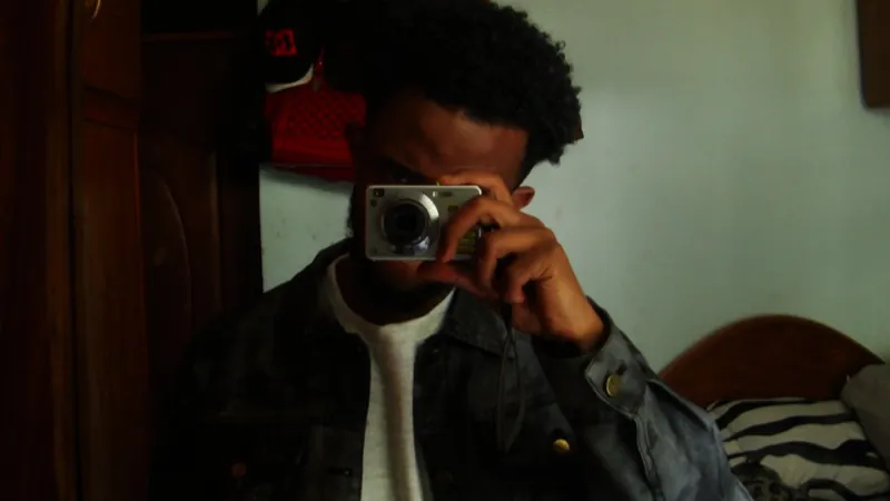 NatiFlux with camera in a candid mirror portrait
